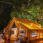 Yellow Colour Inflatable Tent House Setup In The Lawn For House Party